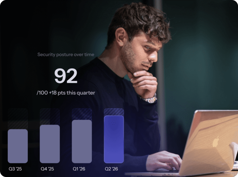 A man gazes at his laptop screen displaying a colorful bar graph, analyzing data trends.